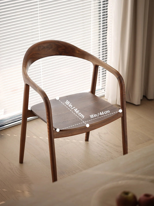 angled view of a curved back walnut dining chair showing the seat width and depth dimensions