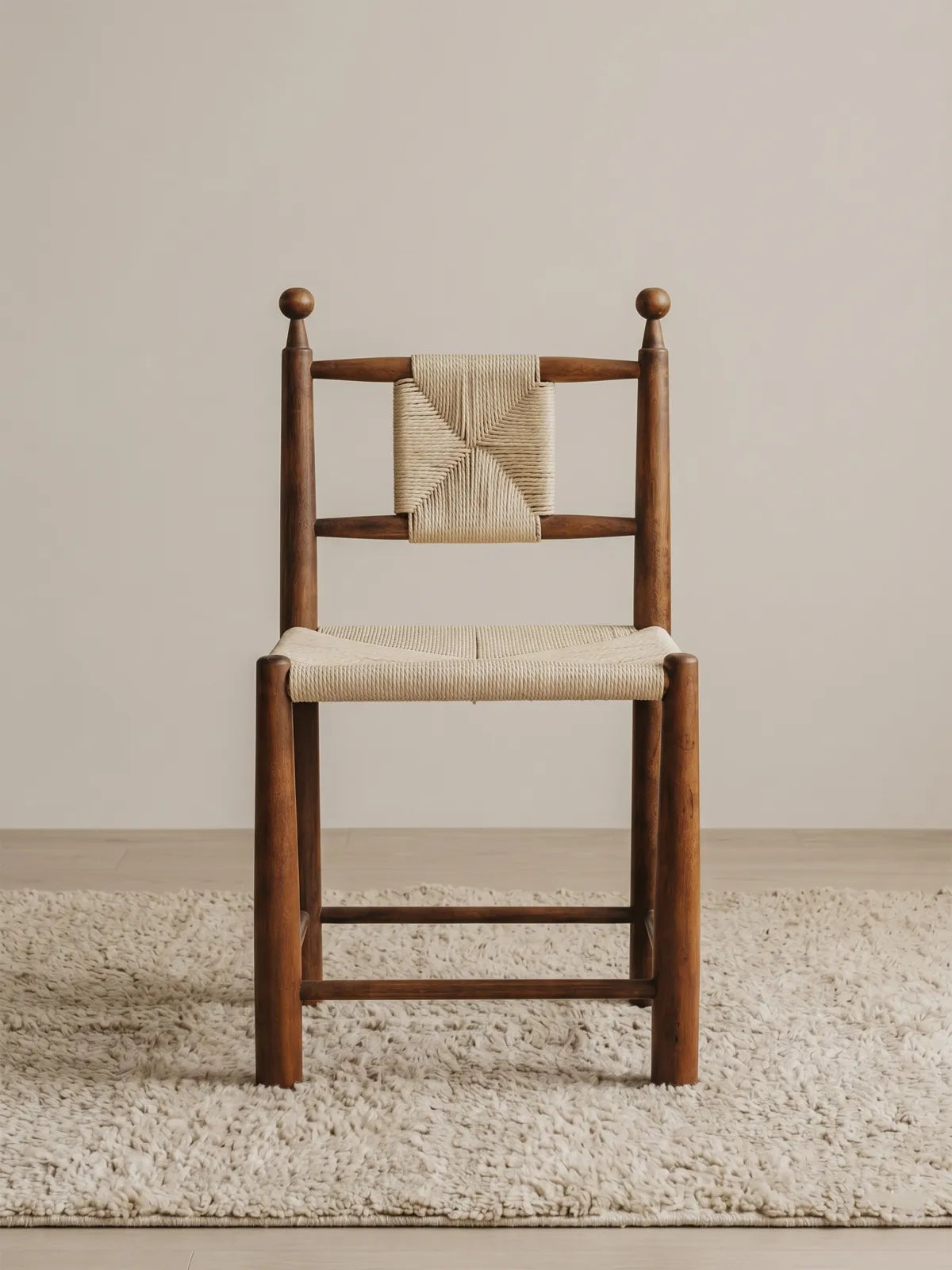 Daren woven rush dining chair in solid walnut, front view showing paper cord seat and backrest with ball finial posts