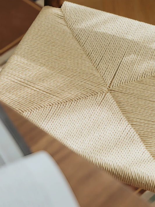 Close-up of the radial paper cord weave pattern on the Daren dining chair seat