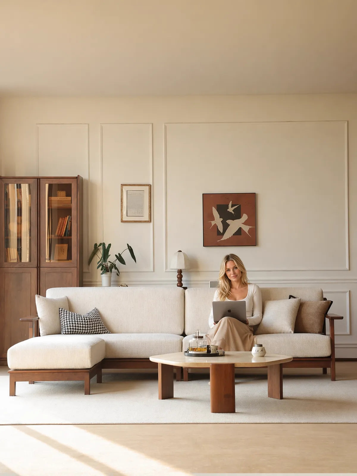 Daren sectional sofa with left chaise in a sunlit living room with wainscoting, woman reading on the sofa
