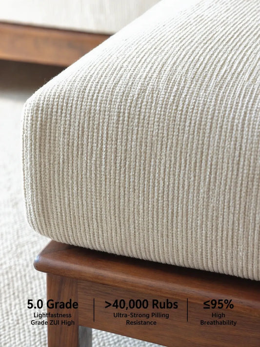 Close-up of Daren sofa cream upholstery texture with fabric performance specs: 5.0 lightfastness, over 40000 rubs, 95 percent breathability