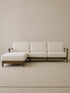 Daren sectional sofa in solid walnut with cream upholstery and left chaise lounge, front three-quarter view on neutral rug