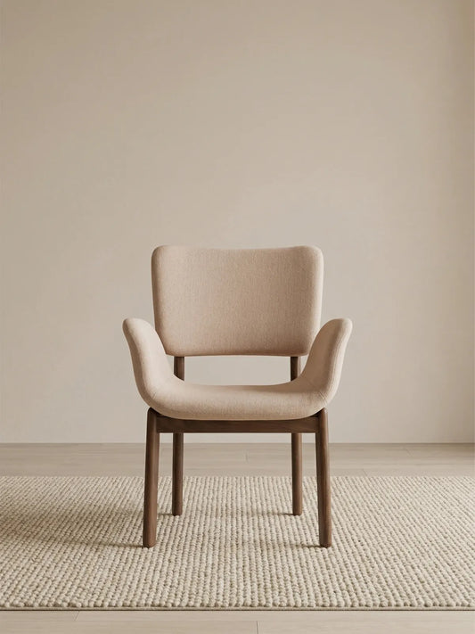 Front view of a beige upholstered dining chair with arms and solid walnut frame (Oatmeal)
