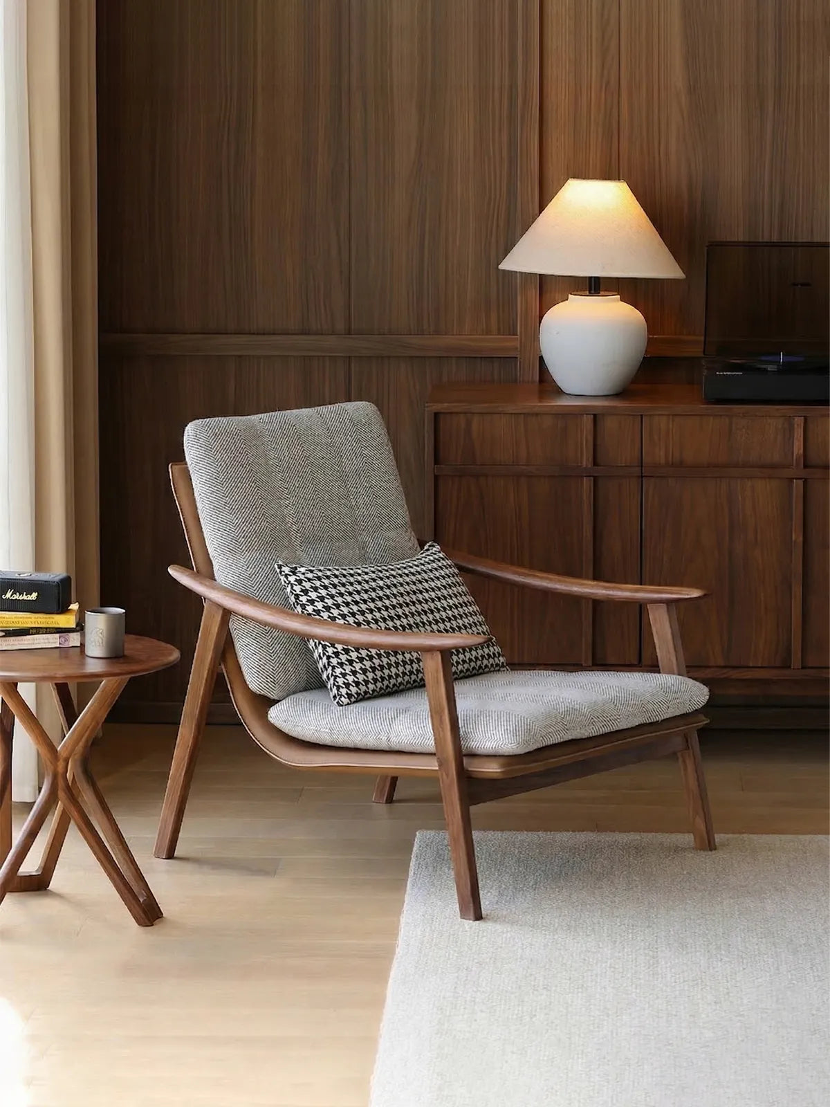 A cozy reading corner featuring the Haven mid century modern reading chair paired with a side table.