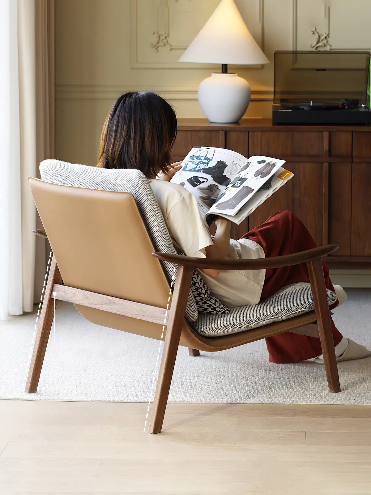 Ergonomic backrest angle of this mid century modern upholstered chair, designed for prolonged reading comfort.