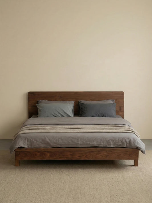 Straight-on studio view of The Helios Bed Frame by Walnutry, featuring a clean mid-century design crafted entirely from premium solid walnut.