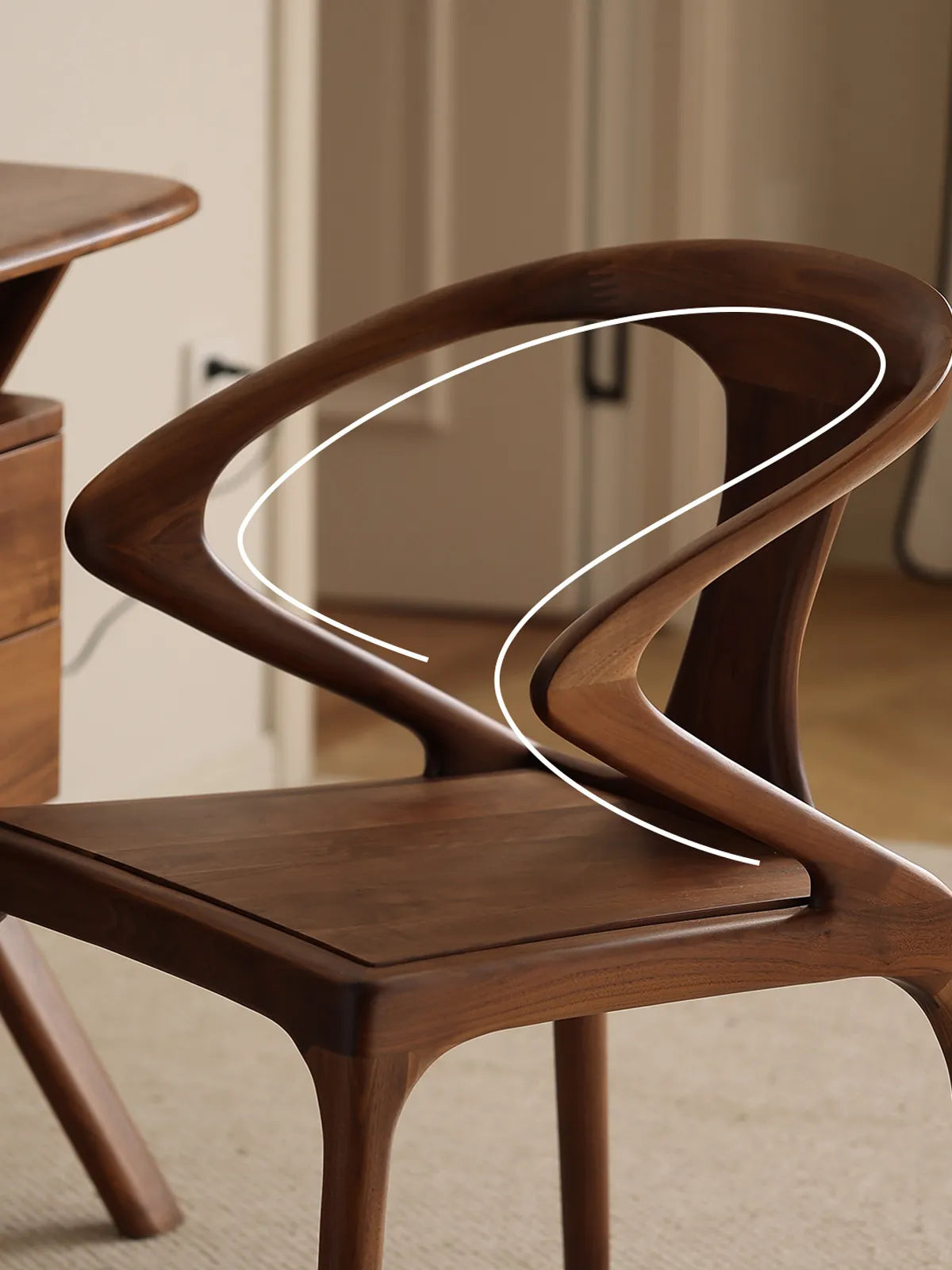 Detail of the Helios chair armrest with graphical lines highlighting the flowing, organic 'S' curve of the handcrafted walnut frame.