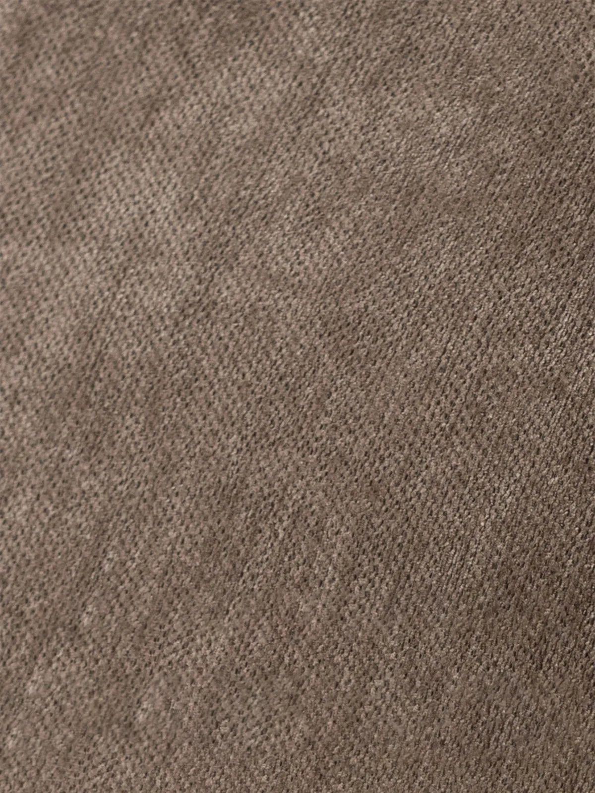 Macro shot detailing the durable, breathable woven brown fabric texture used for the comfortable cushions of The Helios Rocking Chair.