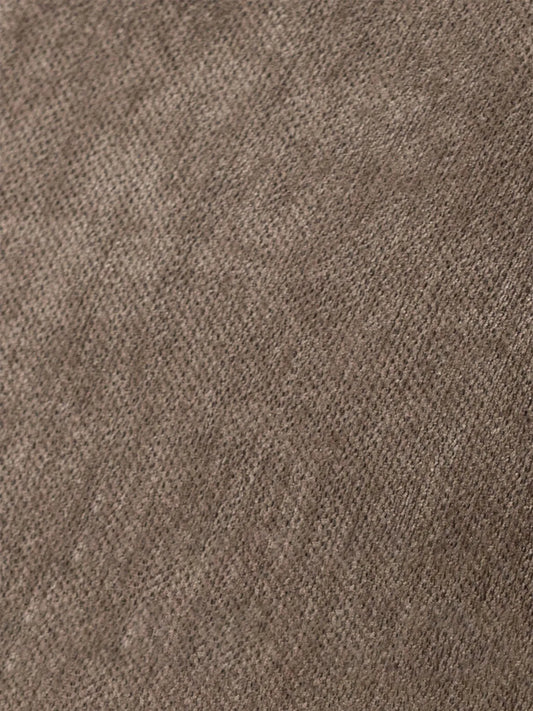 Macro shot detailing the durable, breathable woven brown fabric texture used for the comfortable cushions of The Helios Rocking Chair.