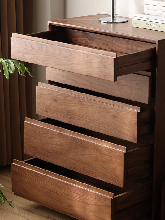 The Heritage 5-Drawer Tallboy shown with all five solid walnut drawers partially open, demonstrating storage capacity and smooth sliding mechanism.