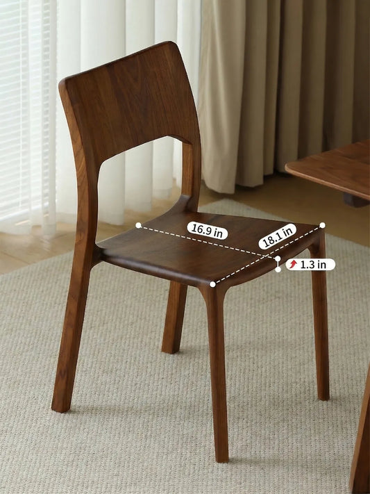 Angled view of The Heritage Dining Chair with dimensional text detailing the precise width, depth, and thickness of the solid wood seat.