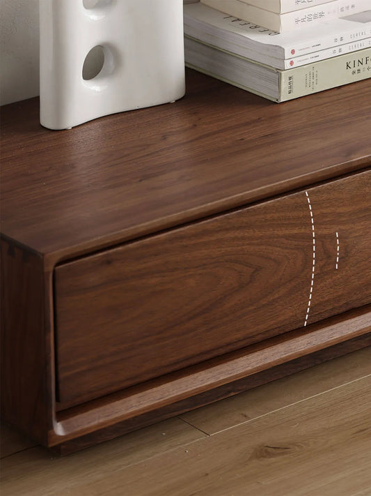 Close-up with dashed lines highlighting the premium continuous wood grain that seamlessly matches across the drawer fronts of The Heritage Media Console.