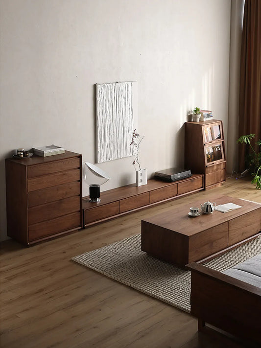 A complete modern living room setup featuring The Heritage Media Console, matching solid walnut coffee table, and storage units by Walnutry.