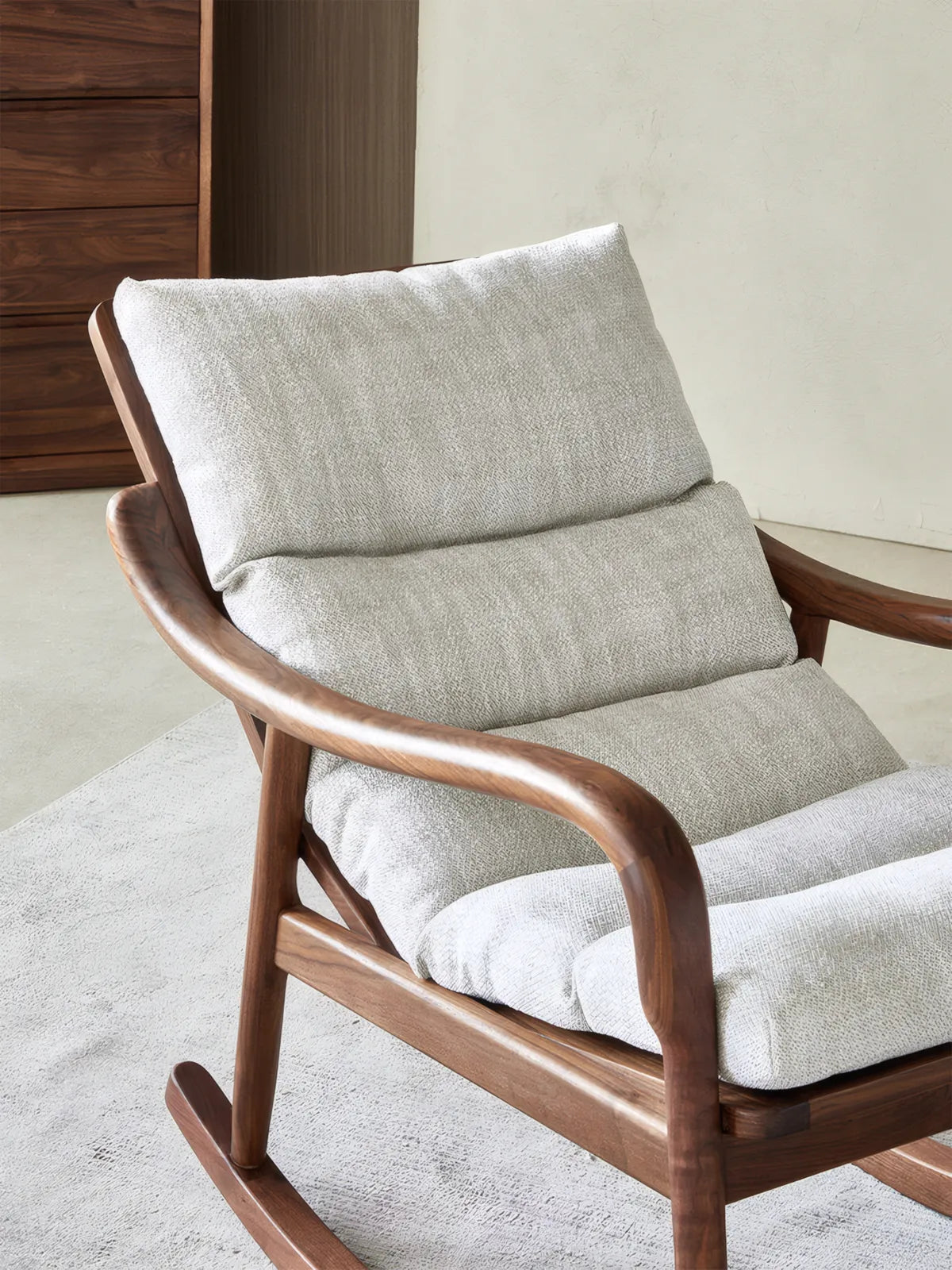 Walnutry Heritage Rocking Lounge Chair cushion close-up with layered back support, textured upholstery, and curved walnut arms for ergonomic lounge chair comfort