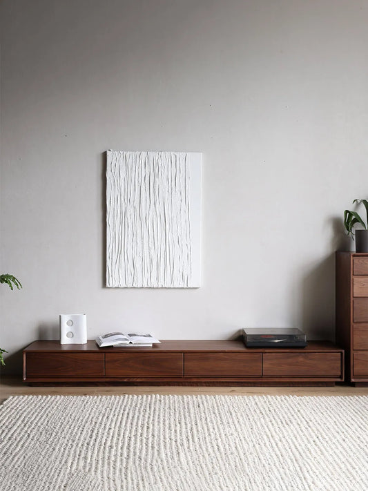 The Heritage Solid Black Walnut Media Console by Walnutry, elegantly styled with a record player and art piece in a minimalist living room.