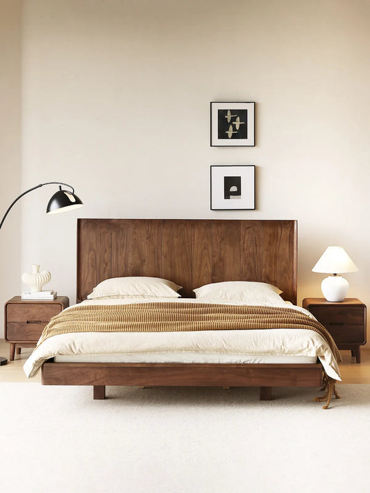 Full view of a serene bedroom decorated with the Heritage mid century bedside table paired with a matching solid wood bed frame.