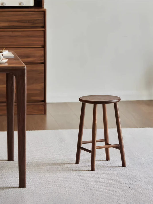 Walnutry Heritage Walnut Stool in kitchen lifestyle setting, walnut counter height stool placed beside dining furniture for warm everyday seating