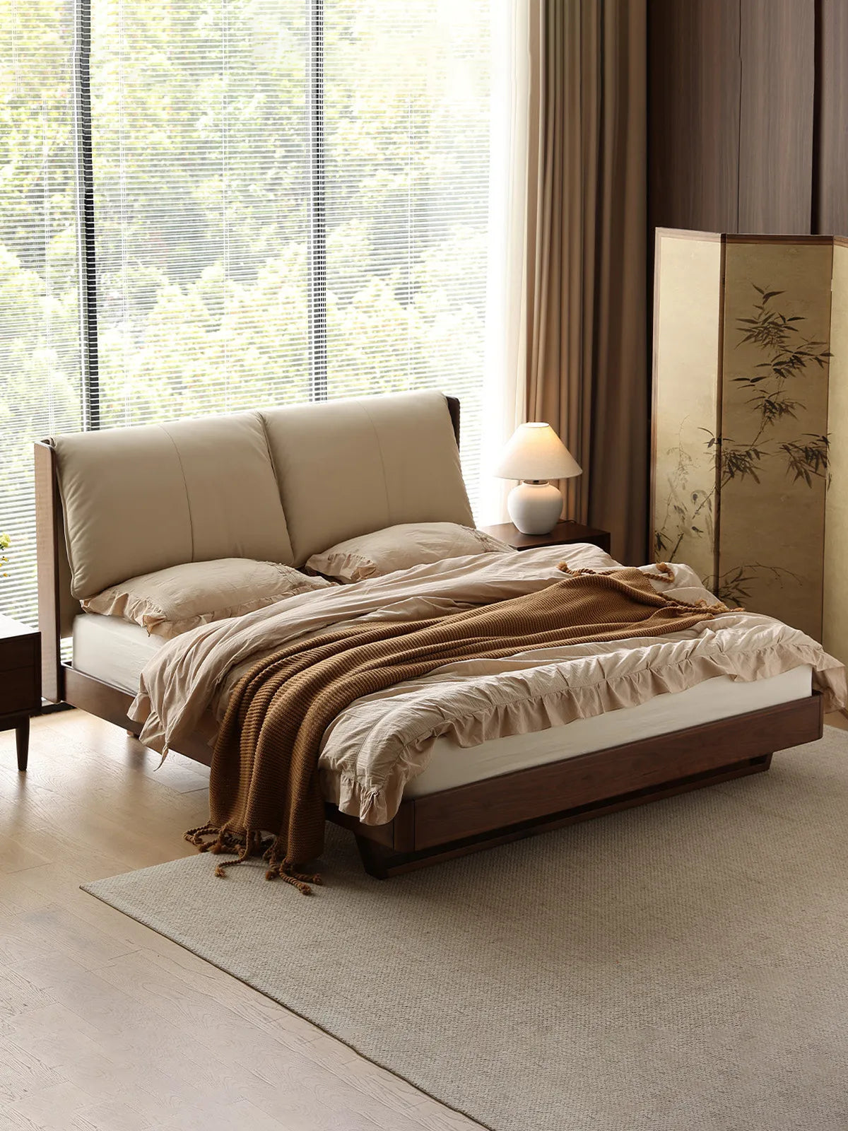Angled view of our mid century modern platform bed bathed in natural light, highlighting the hidden legs and floating effect.
