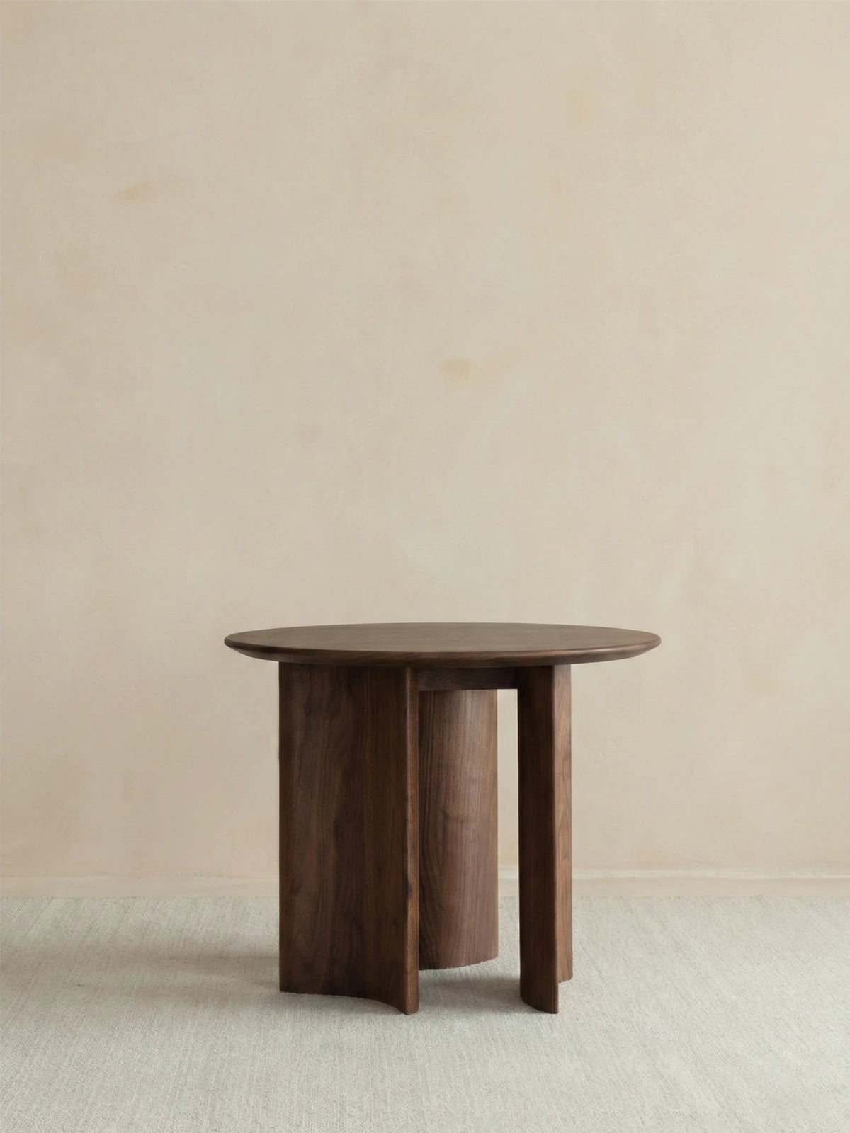Clean front view of the Cumberland mid century modern round side table, showcasing its solid wood construction and elegant vertical support.