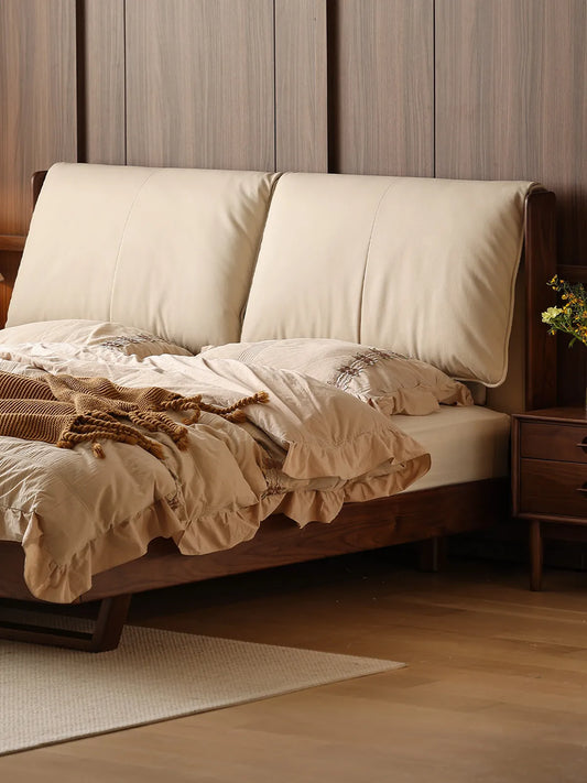 Close up of the mid century modern upholstered bed, showing the dual split leather cushions perfectly angled for ergonomic back support.