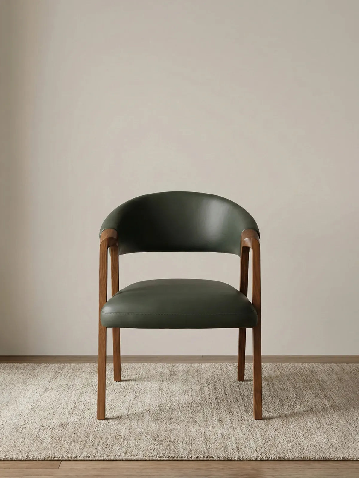 Walnutry modern dining chair featuring a solid North American black walnut frame with a curved backrest and premium olive green leather upholstery.