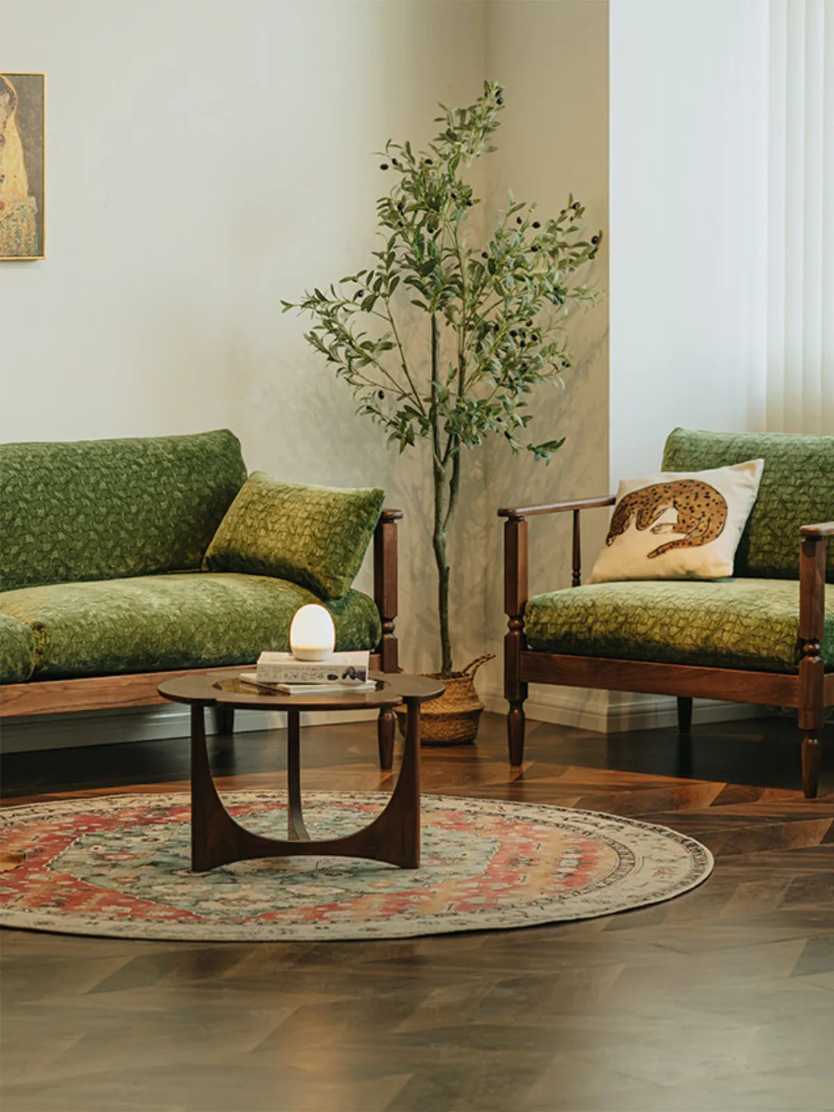 The Morris collection featuring the solid black walnut sofa and matching armchair arranged in a classic, sophisticated interior.