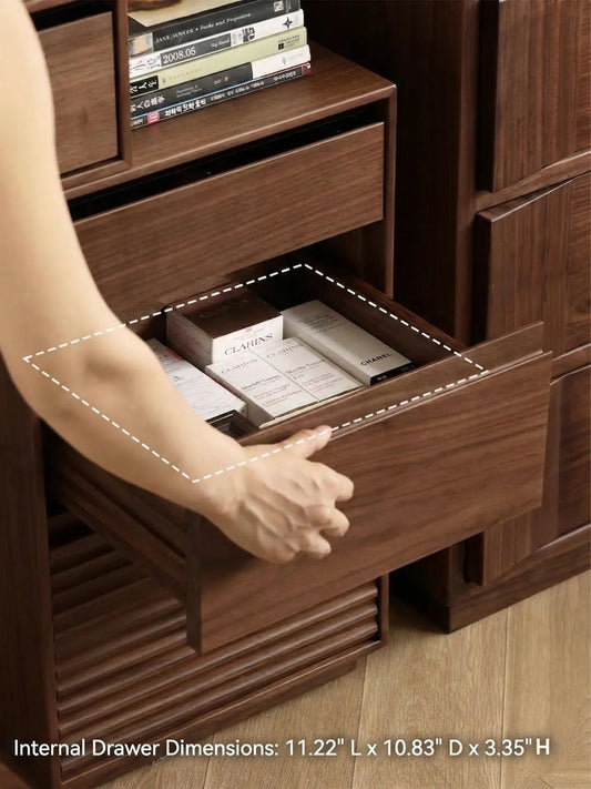 A person opening the top drawer of the Muse integrated nightstand, displaying interior dimensions and organized storage for skincare boxes.