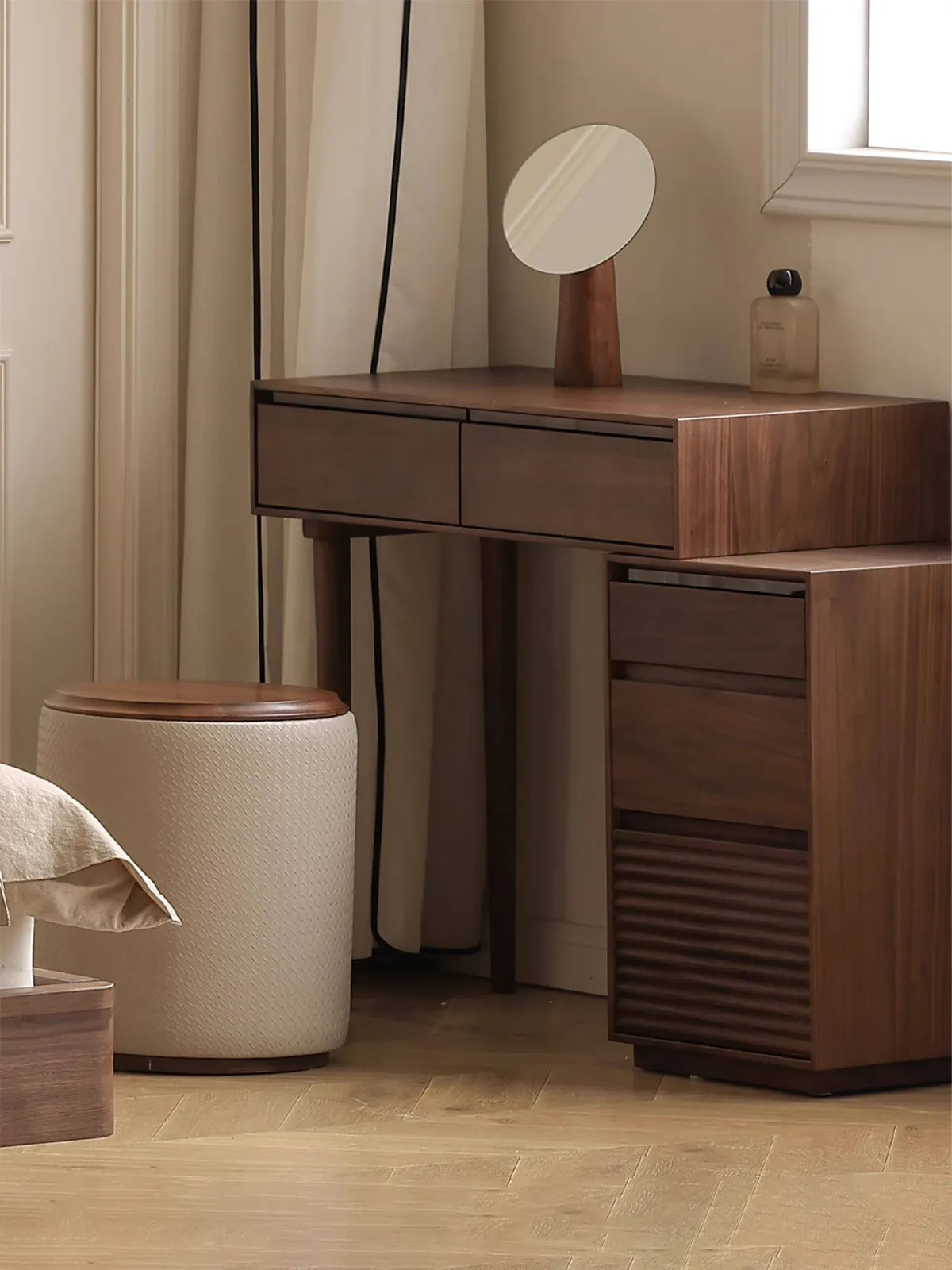 The Muse Solid Black Walnut Vanity Desk and Integrated Nightstand arranged in a flexible L-shaped corner configuration, maximizing bedroom space.
