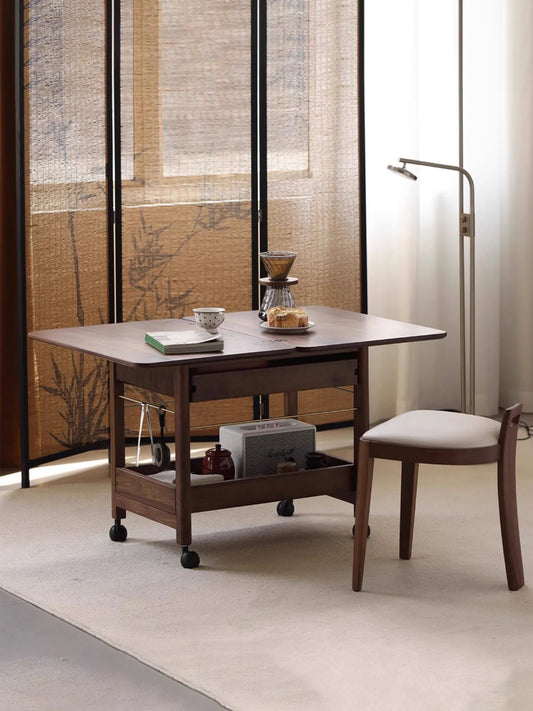 The Nomad Mobile Folding Side Table by Walnutry in solid black walnut, fully extended and styled as a mobile coffee station.