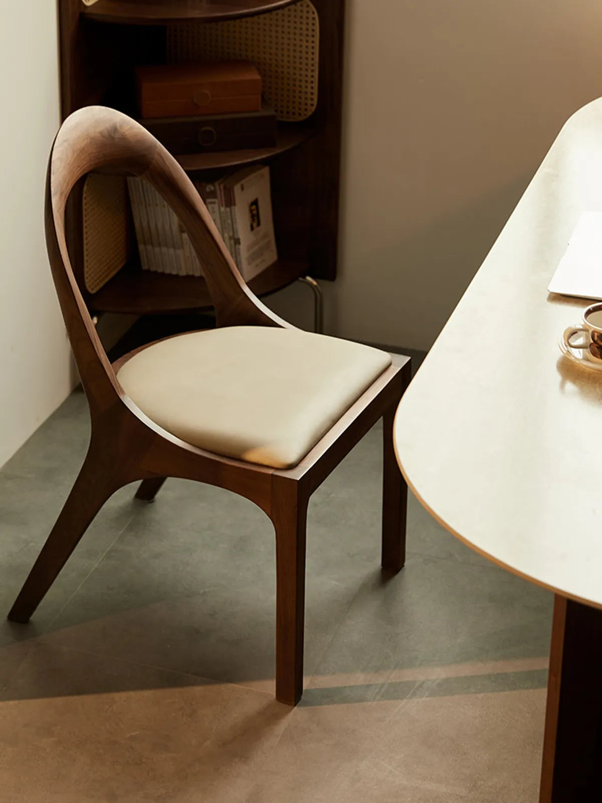 Side view of the Oryn dining chair highlighting the proportions and cushioned seat depth.