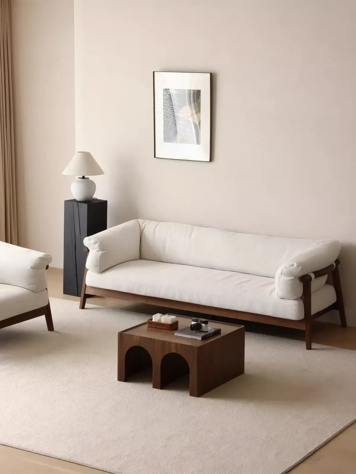 Oslo 3-seater walnut frame sofa in cream bouclé, three-quarter angle in styled living room