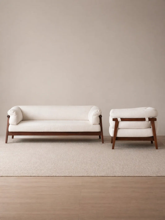 Oslo 3-seater sofa and single chair in cream bouclé with solid walnut frame, front view on neutral background (3-Seater with Chaise Lounge)