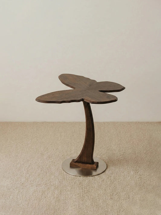 A full studio shot of the Papillon Solid Walnut Accent Table showcasing its artistic mid-century modern design.