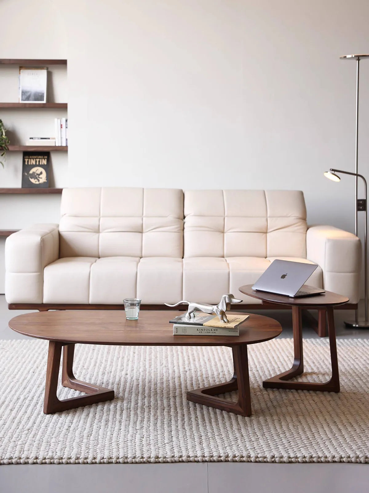 Front view of the two-piece Pebble Nesting Coffee Table Set displayed in a bright, minimalist living room.
