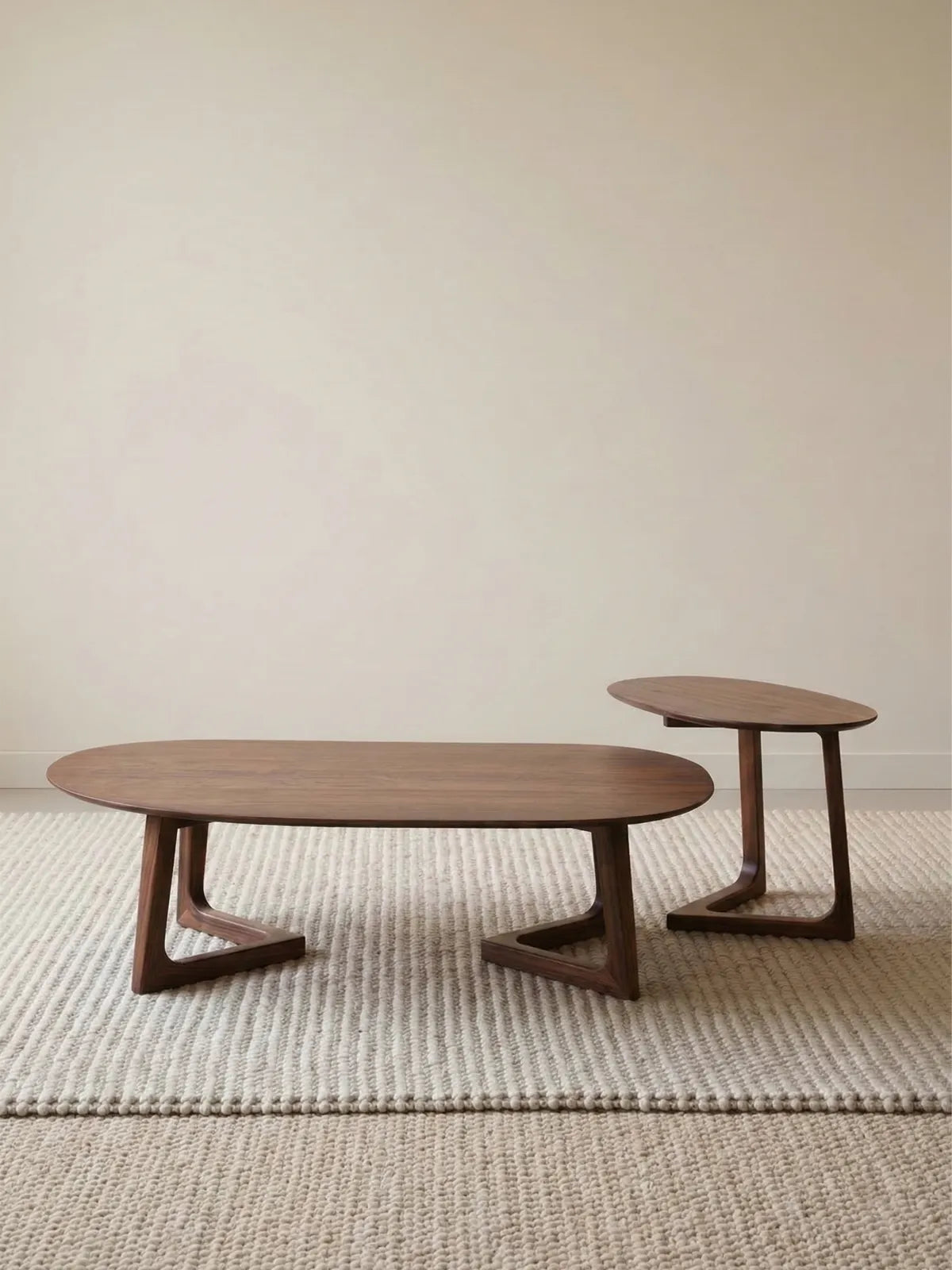 The minimalist Pebble Nesting Coffee Table Set in North American Black Walnut against a clean white background.