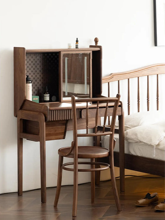 Salo walnut spindle back chair used at a vanity desk in a bedroom setting beside a spindle headboard bed