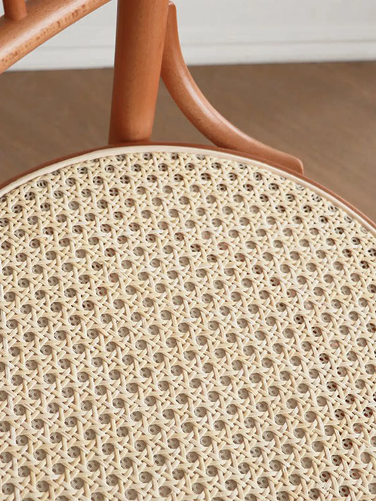 Close-up of natural rattan cane weave seat option on the Salo dining chair showing hexagonal cane pattern
