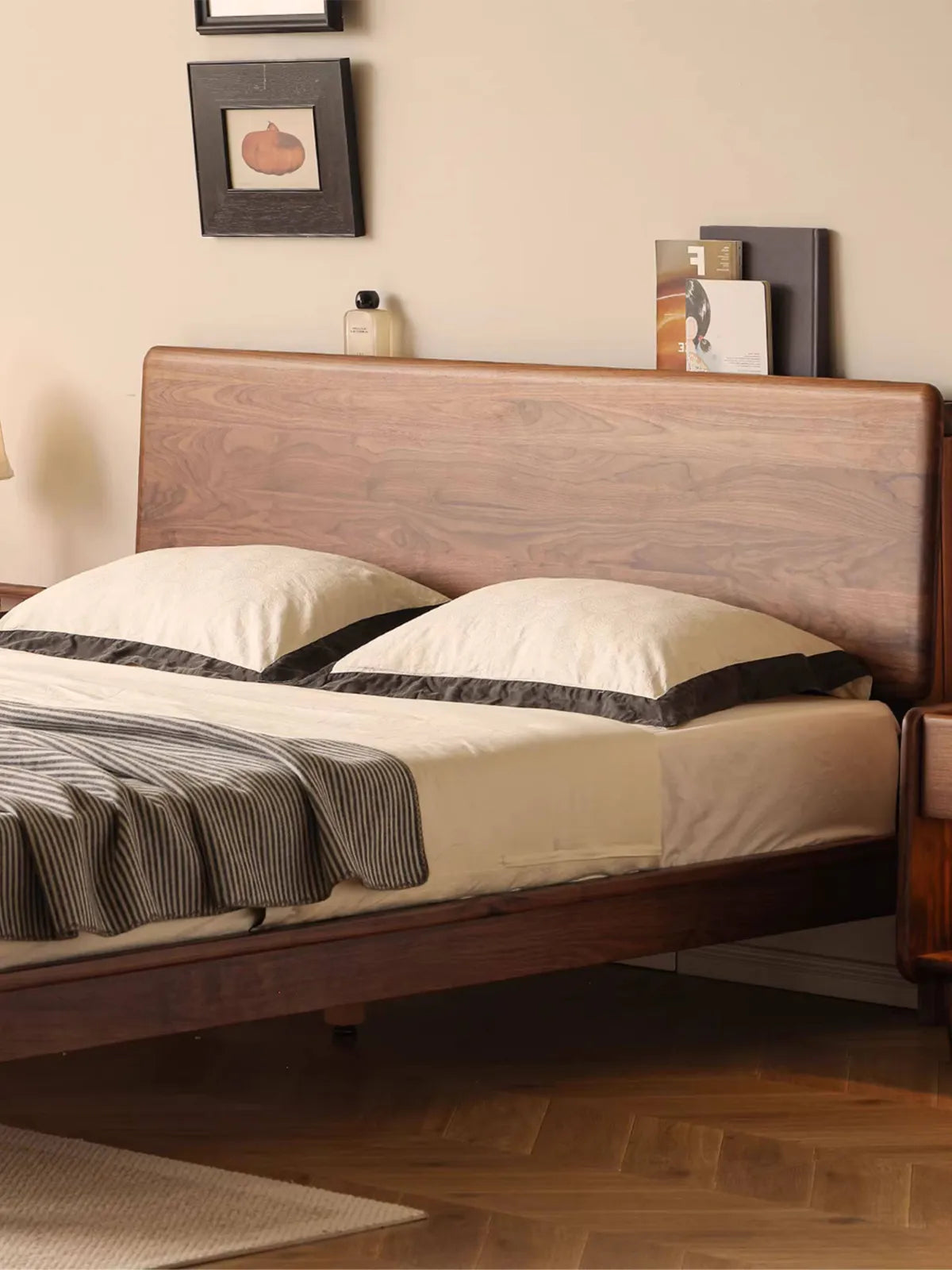Close-up of the expansive solid wood headboard on The Haven platform bed, showcasing the rich, natural North American Black Walnut wood grain.