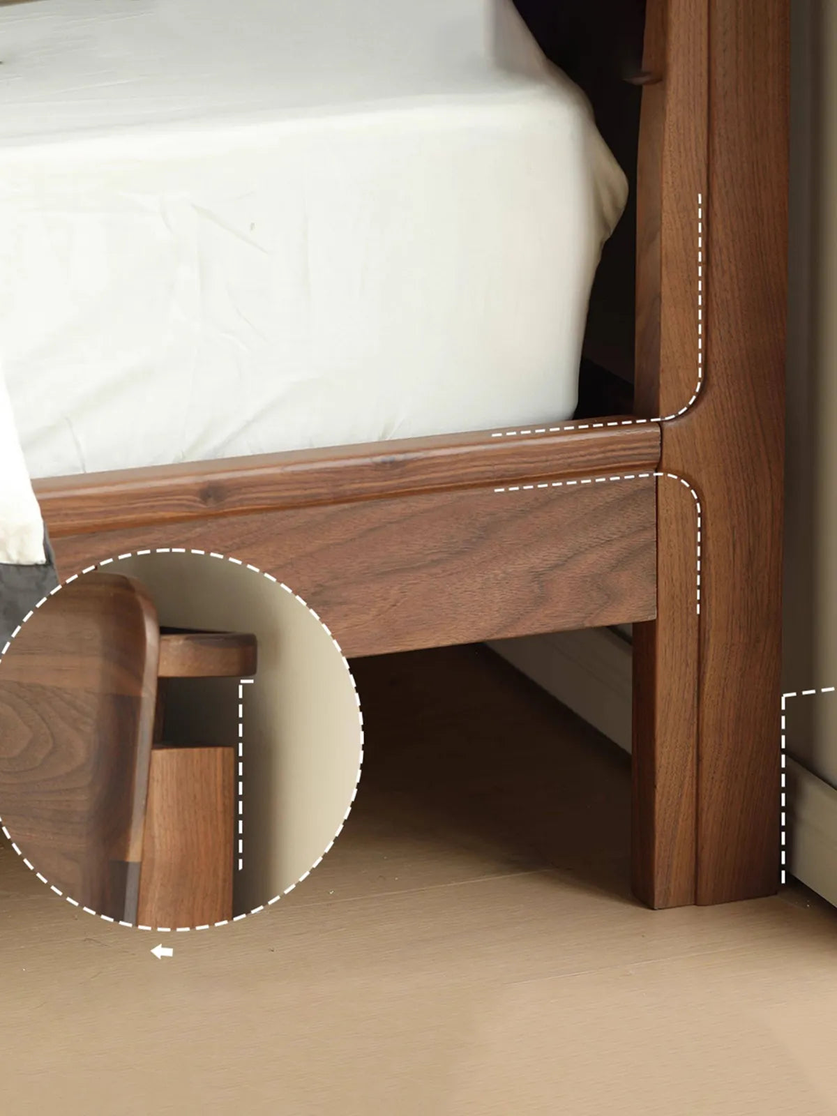 Detailed view of the baseboard clearance notch on the back legs of this solid wood king bed, designed to allow the frame to sit perfectly flush against the wall.