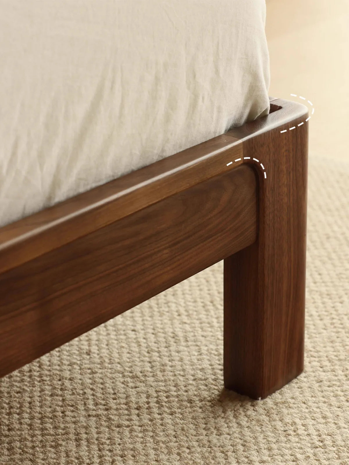 Close-up of the smooth, rounded corner joinery seamlessly connecting the side rail to the front leg on the solid wood platform bed queen.