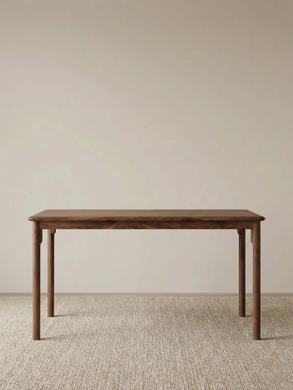 Front view of The Cumberland solid wood table against a plain background, emphasizing the clean lines, tapered legs, and premium construction.