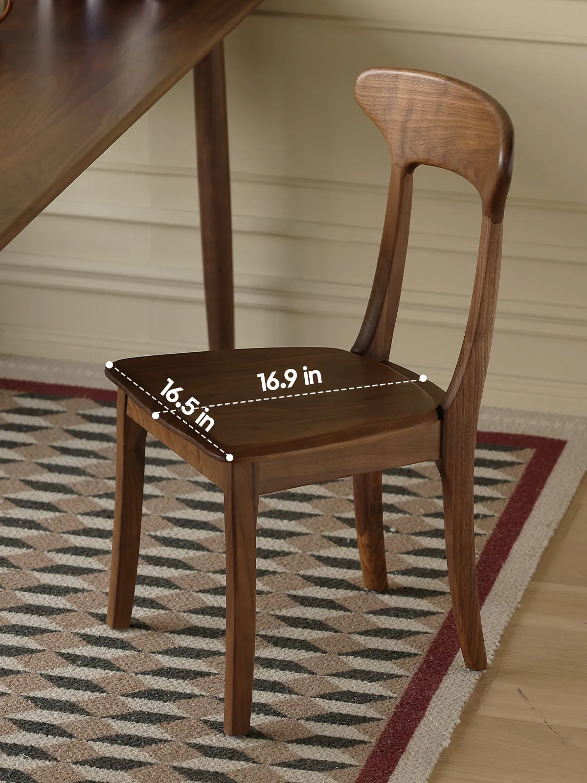 Sora walnut dining chair from above showing seat dimensions of 16.9 in by 16.5 in