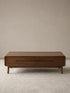 Front view of a solid walnut rectangular coffee table with two drawers and rounded frame edges