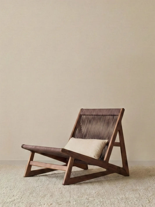 Front view of Walnutry Suiseki lounge chair showing solid black walnut frame and low profile design against a minimal background.