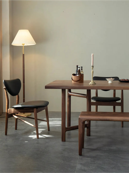 Side profile of the Sylvan chair showing the floating backrest and tapered legs of these mid century modern wood dining chairs.