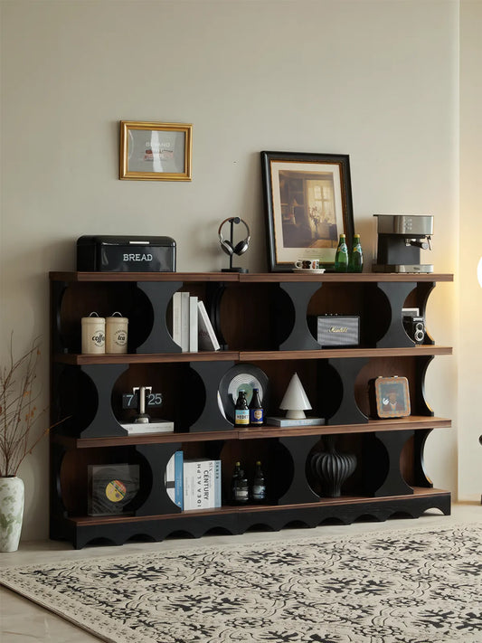 Low-profile version of the Sylvan modern walnut bookcase used as a console table with open geometric cubbies.