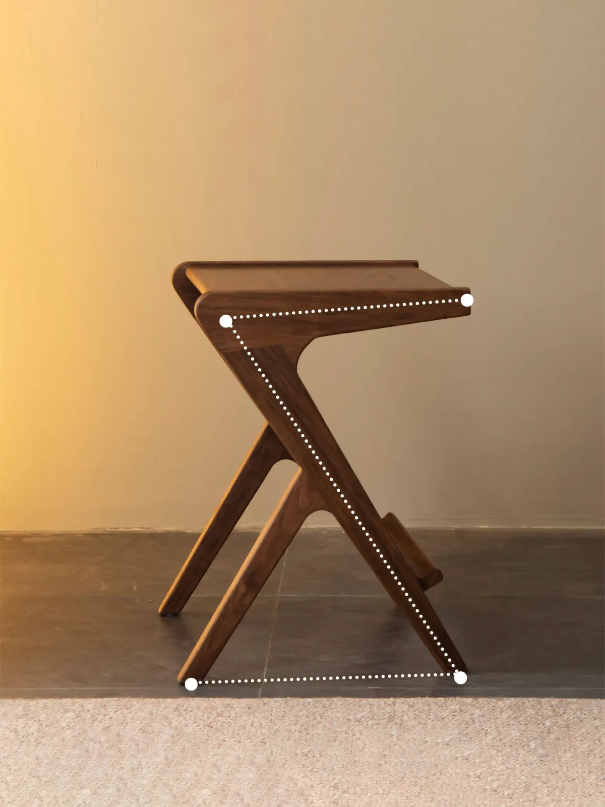 Minimalist product shot of the Sylvan Z-table against a warm background, emphasizing the mid-century modern geometric silhouette.