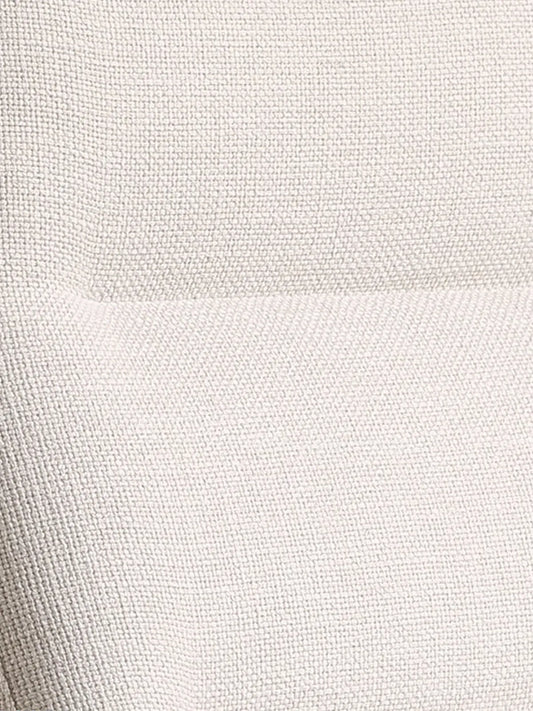 Close-up of the premium, breathable light beige fabric upholstery on The Haven Lounge Chair.