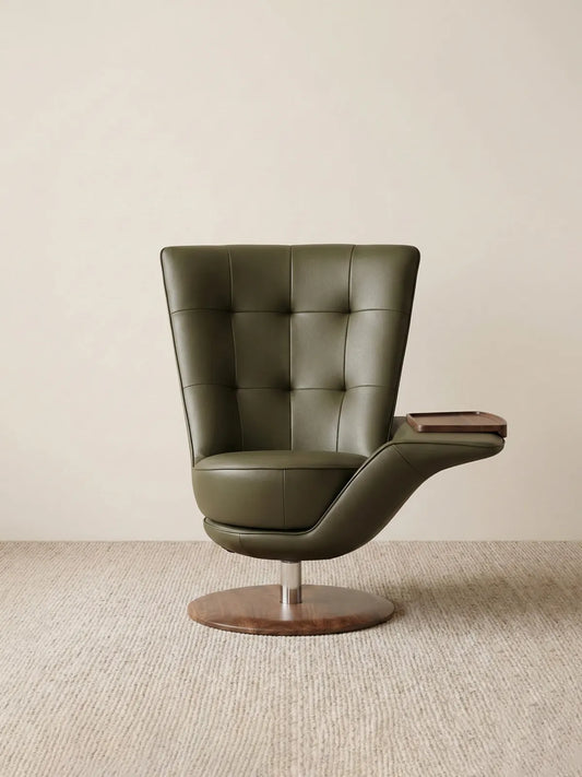 Front view of The Helios Retreat Swivel Recliner showcasing its green leather upholstery and solid black walnut swivel base against a neutral background.