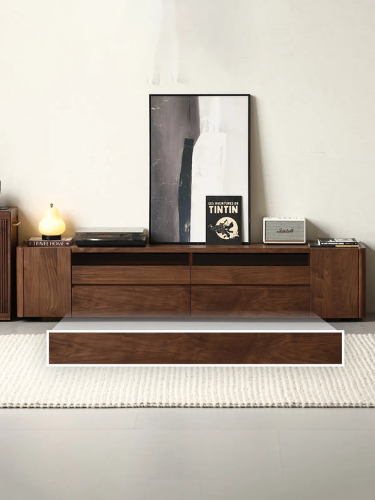 Front view of The Pebble Media Console with a graphic overlay highlighting its sturdy, solid wood plinth base.